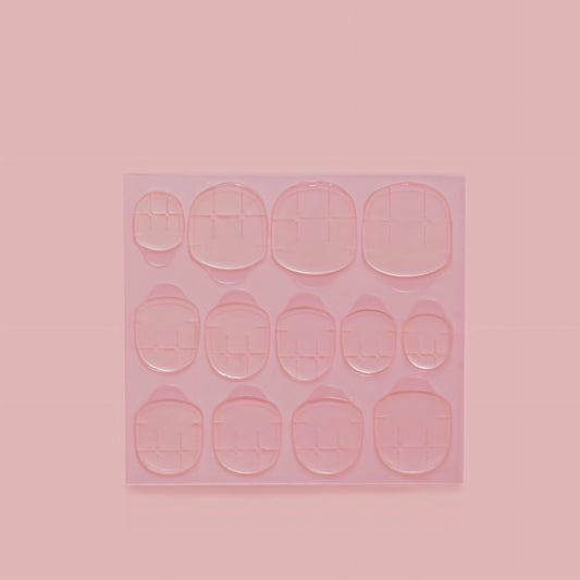 Image of nail adhesive tabs, an easy-to-use alternative to traditional nail glue.